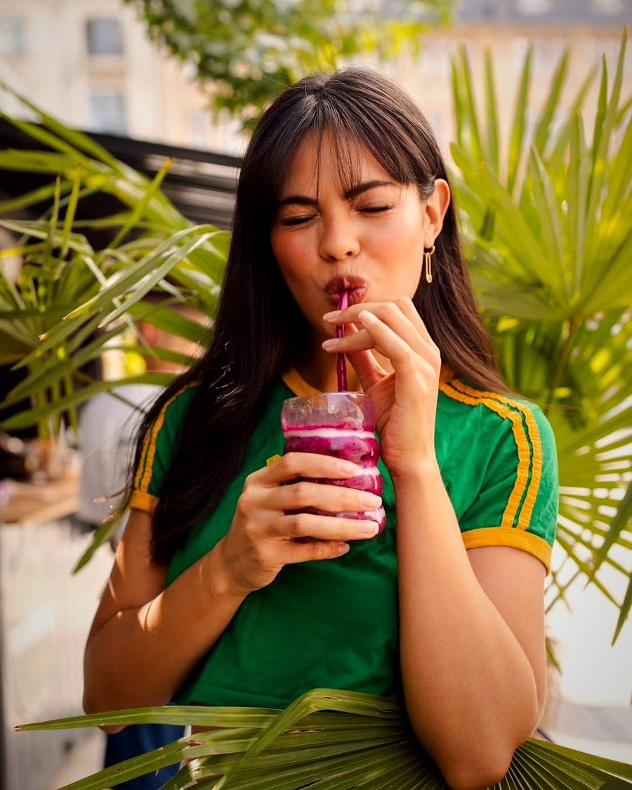 Guest enjoying a Vitamin B smoothie in the sun